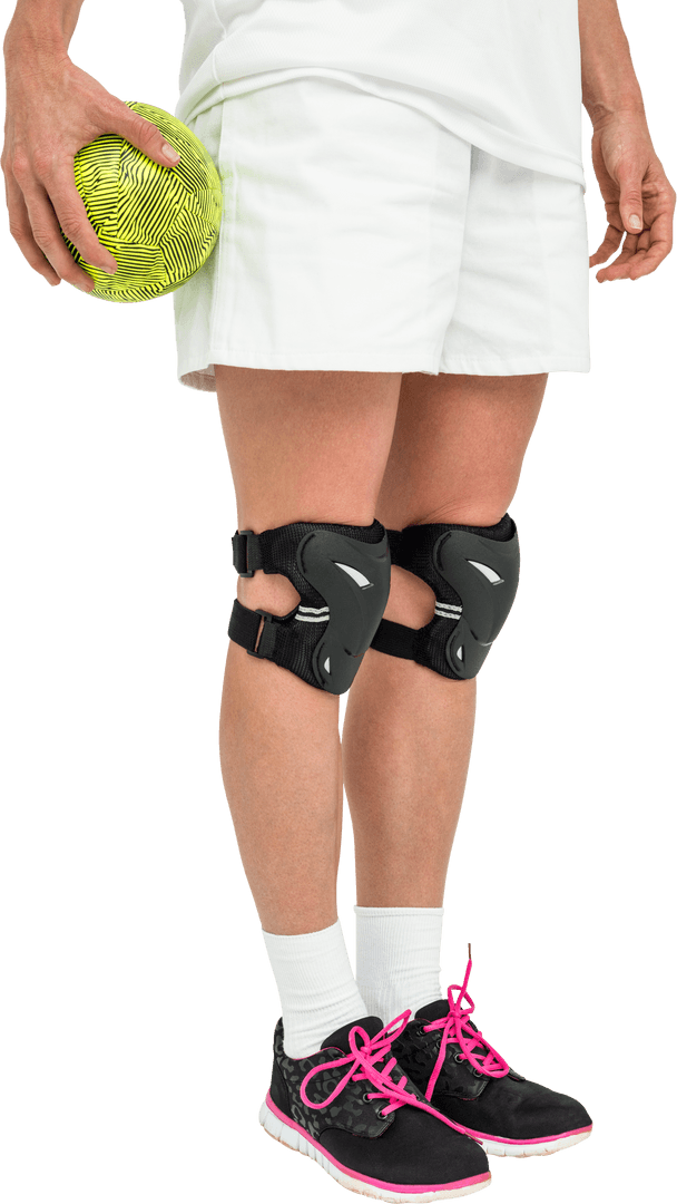 Athlete with Knee Braces Holding Ball on Transparent Background