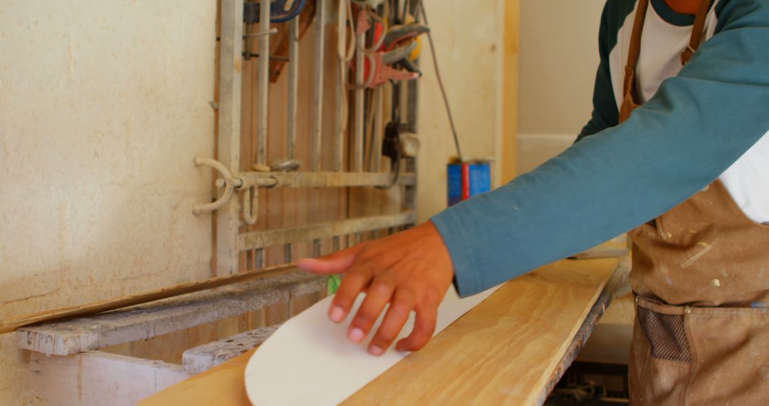 Woodworker using sanding tool on flat wooden surface in workshop - Free Images, Stock Photos and Pictures on Pikwizard.com