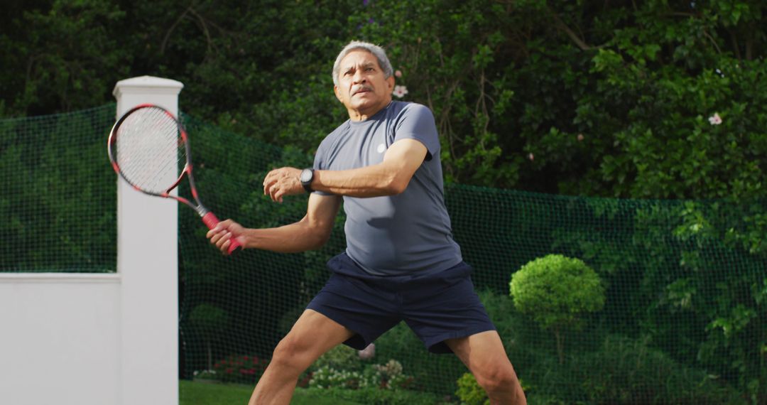 Senior Man Playing Tennis in Backyard - Free Images, Stock Photos and Pictures on Pikwizard.com