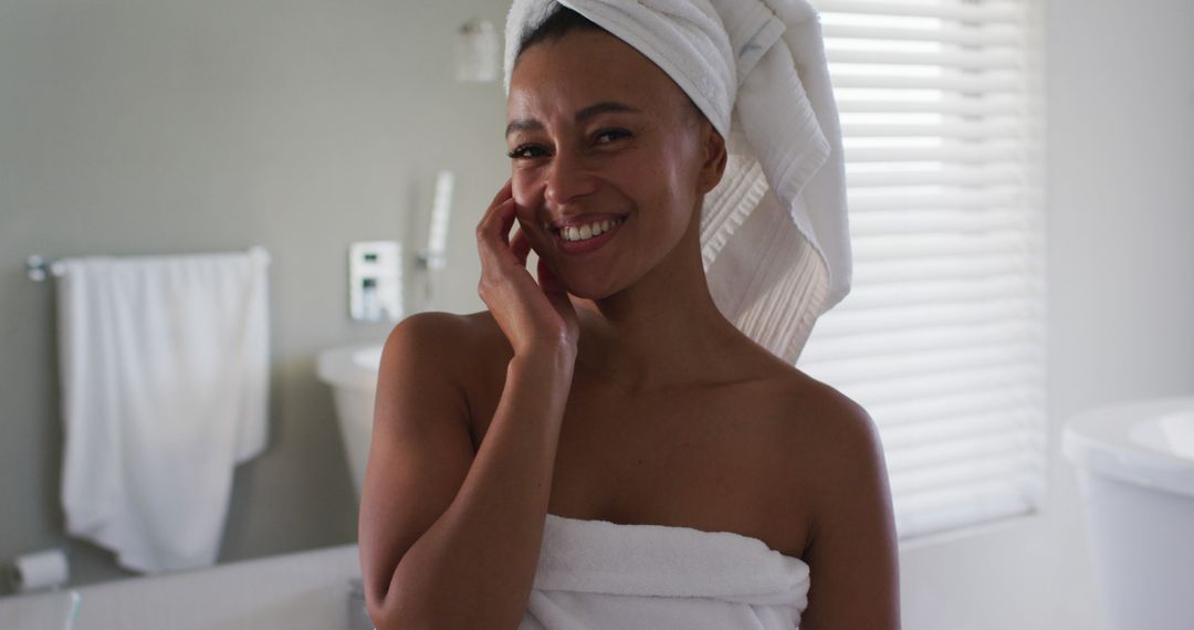 Smiling Woman in Bathroom After Shower Wrapped in Towel - Free Images, Stock Photos and Pictures on Pikwizard.com