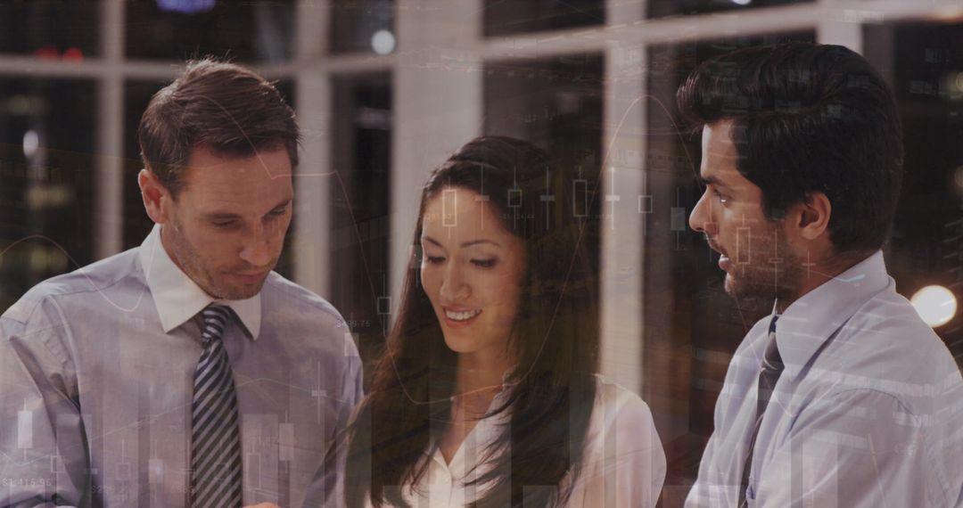 Business Team Engaged in Financial Analysis with Digital Graphs Overlay