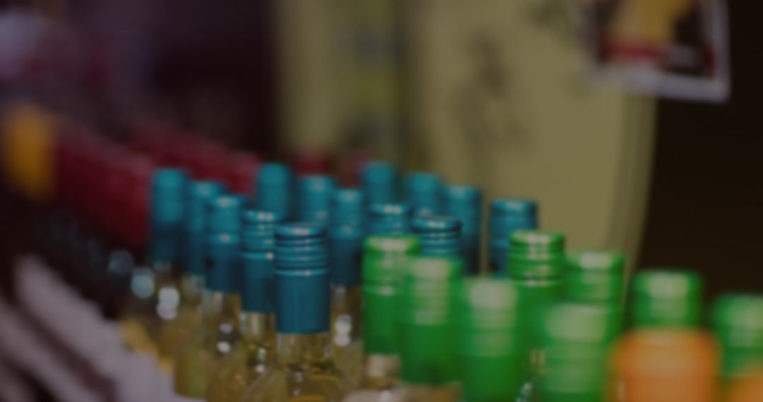 Rows of Wine Bottles with Colorful Caps in Liquor Store