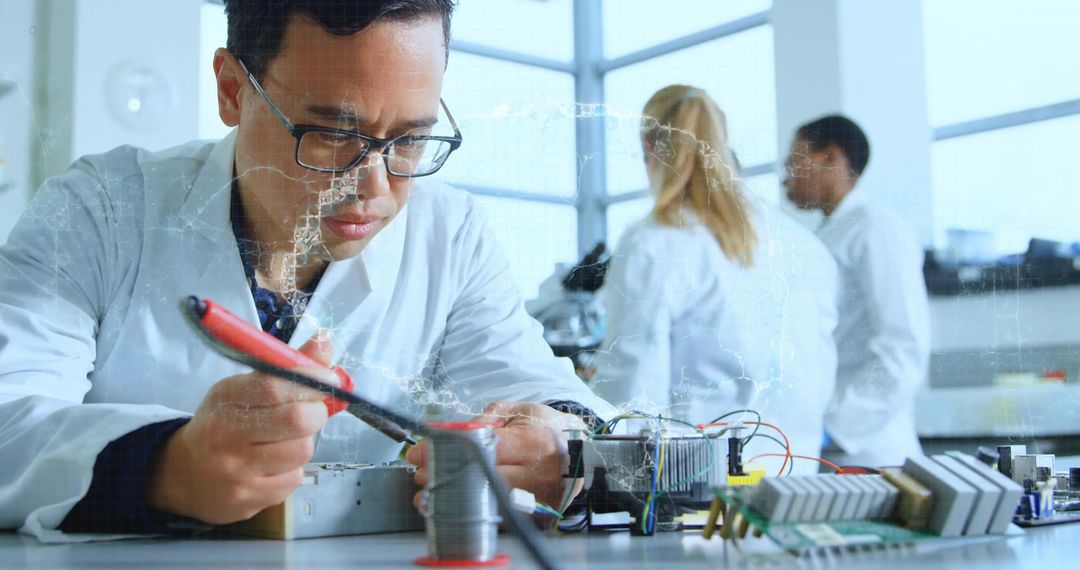 Technician Soldering Electronics in Modern Laboratory