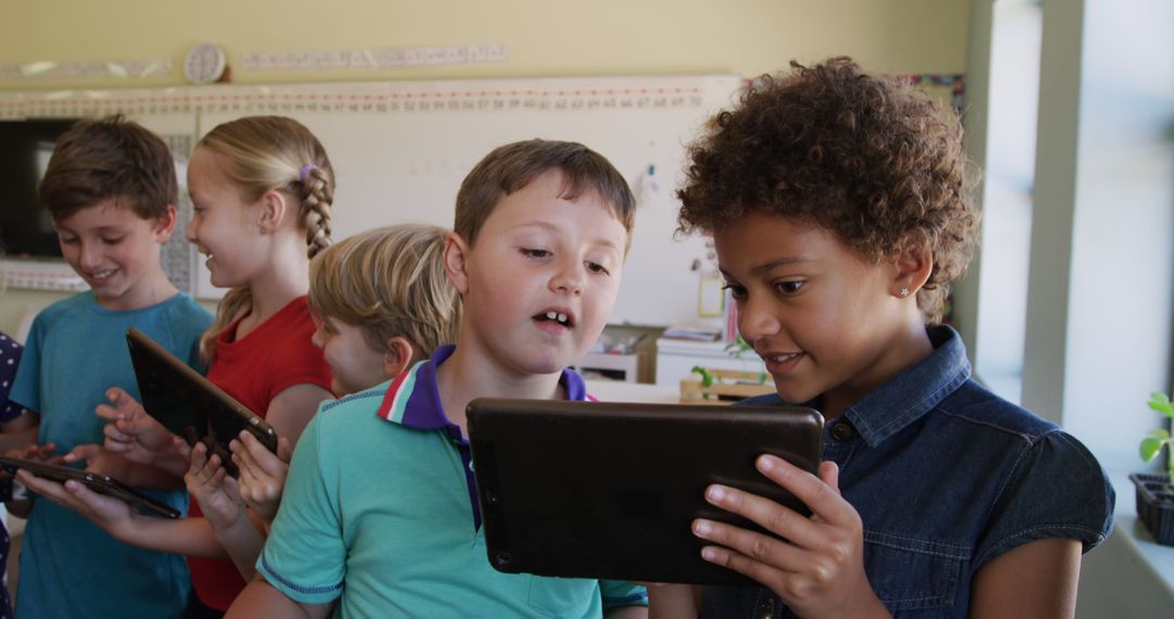 Children Engaging with Tablets in Classroom Setting - Free Images, Stock Photos and Pictures on Pikwizard.com