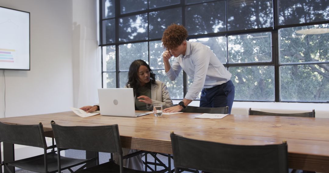 Diverse Colleagues Collaborating on Corporate Project Using Technology