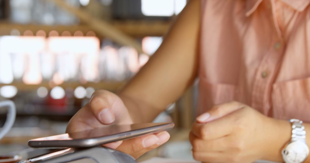 Close-Up of Person Using Mobile Wallet for Contactless Payment - Free Images, Stock Photos and Pictures on Pikwizard.com