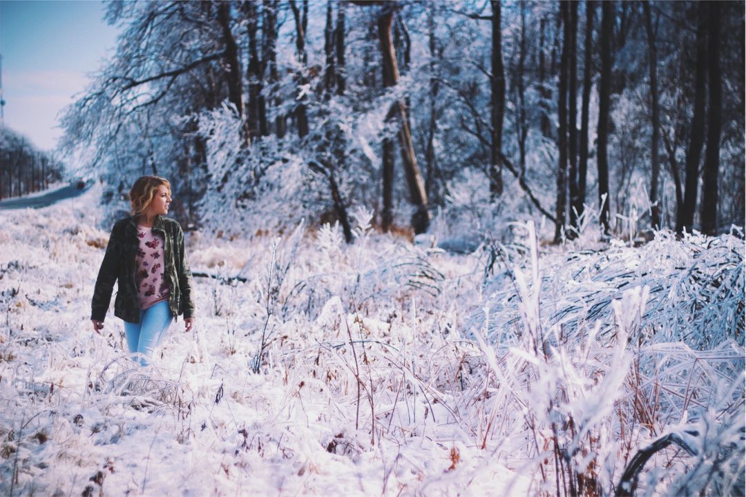 Woman Walking Through Snowy Winter Forest - Free Images, Stock Photos and Pictures on Pikwizard.com