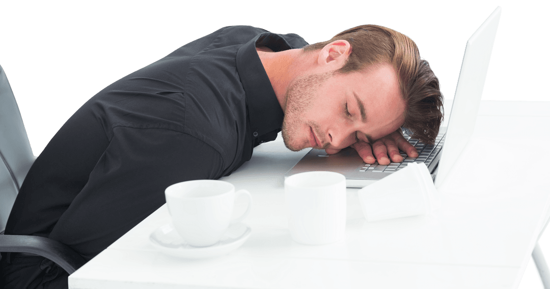 Exhausted Businessman Sleeping on Laptop with Coffee Cup