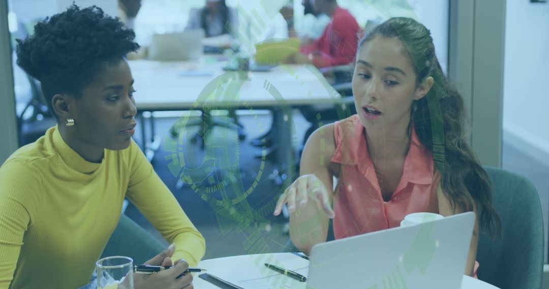 Diverse Businesswomen Collaborating in Financial Data Analysis