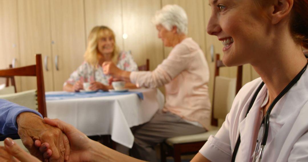 Smiling Nurse Assisting Elderly Patient in a Nursing Home - Free Images, Stock Photos and Pictures on Pikwizard.com