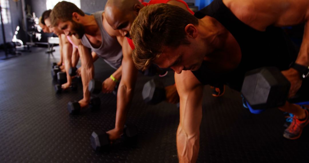 Group of Men Working Out in Gym with Weights - Free Images, Stock Photos and Pictures on Pikwizard.com