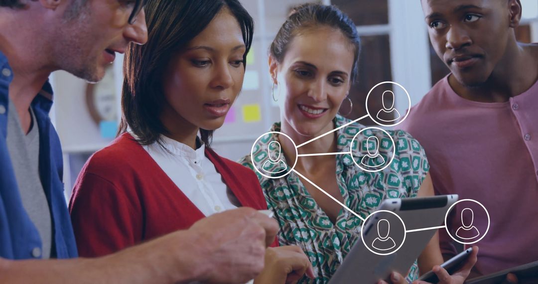 Diverse Team Examining Digital Network on Tablet in Collaborative Workspace