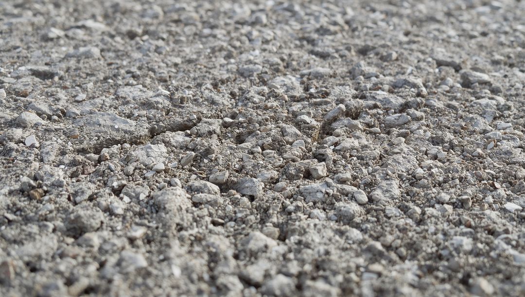 Crushed Gravel Ground Texture with Small Stones and Pebbles Close-Up for Backgrounds