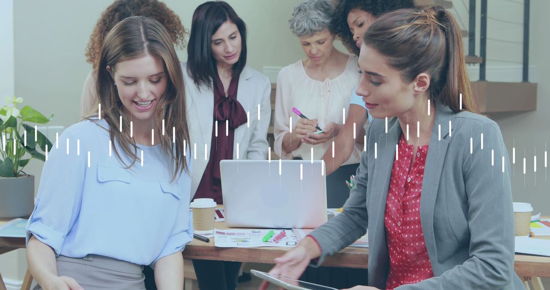 Diverse Business Team Analyzing Financial Data on Laptops