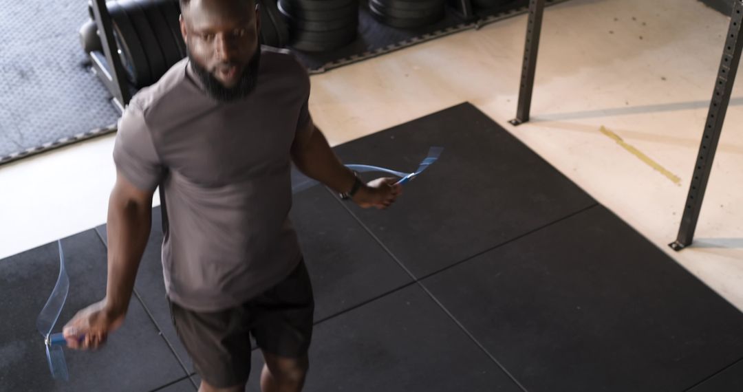 Man Doing Jump Rope Exercise in Gym for Cardiovascular Fitness