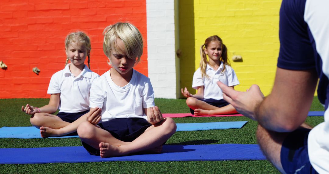 Children Practicing Yoga with Instructor Outdoors - Free Images, Stock Photos and Pictures on Pikwizard.com