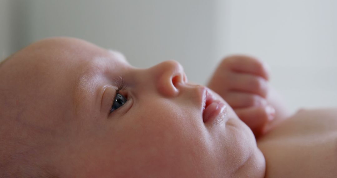 Close-Up Portrait of Peaceful Newborn Baby Looking Away - Free Images, Stock Photos and Pictures on Pikwizard.com