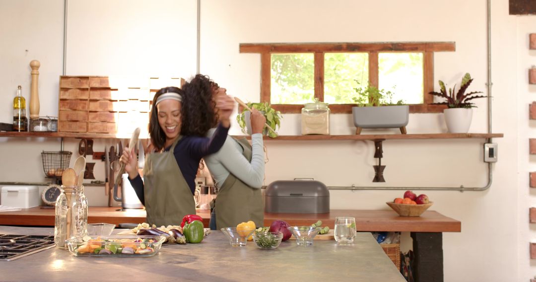 Friends Dancing and Cooking in Stylish Rustic Kitchen