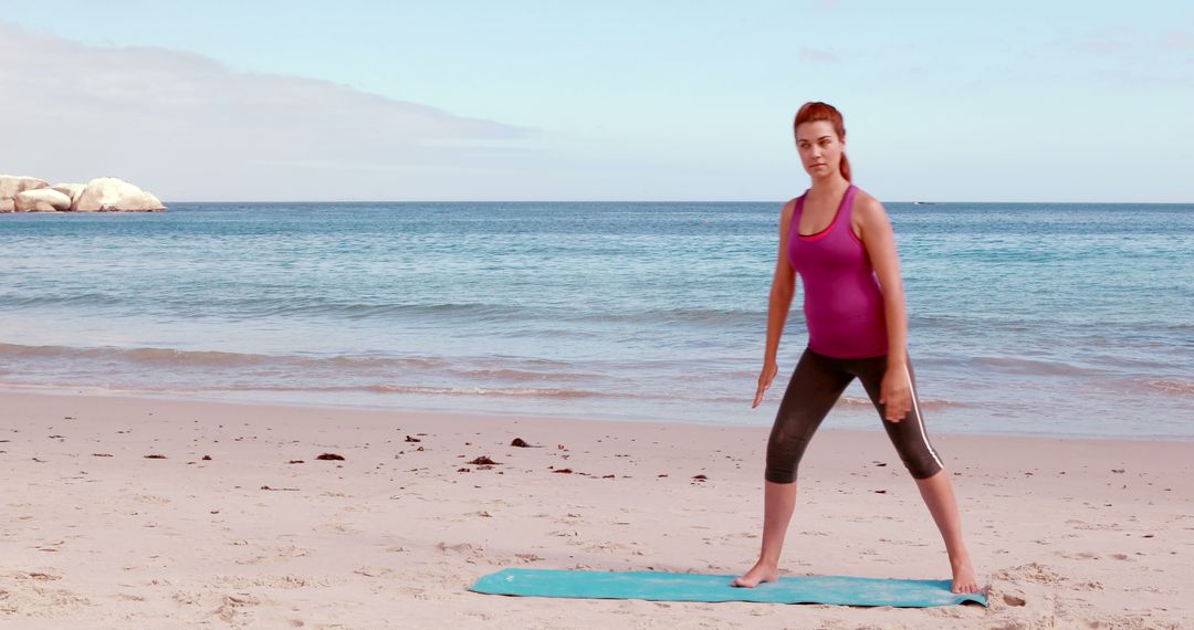 Woman Practicing Yoga on Beach, Looking Confident and Focused - Free Images, Stock Photos and Pictures on Pikwizard.com