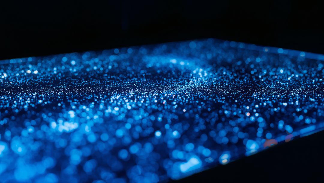 Shimmering Blue Glitter Surface with Bokeh Macro Sparkles for Tech and Abstract Background