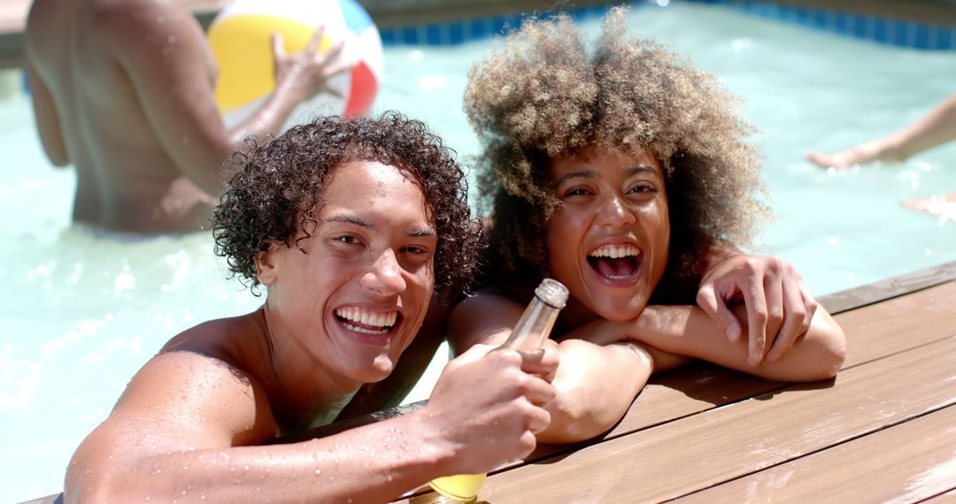 Diverse Friends Celebrating at Vibrant Pool Party with Drinks