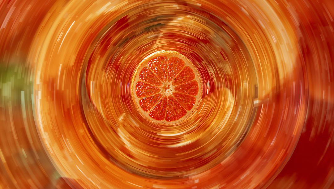 Spinning Citrus Slice with Radiating Pixel Streaks in Amber Gradients