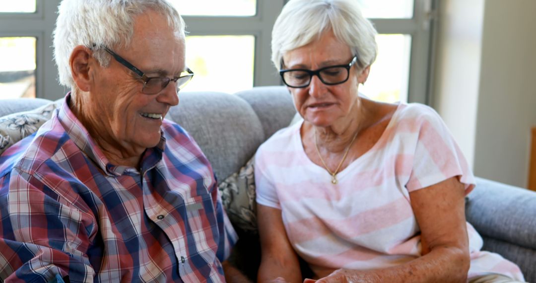 Senior caucasian couple sharing warm conversation at home