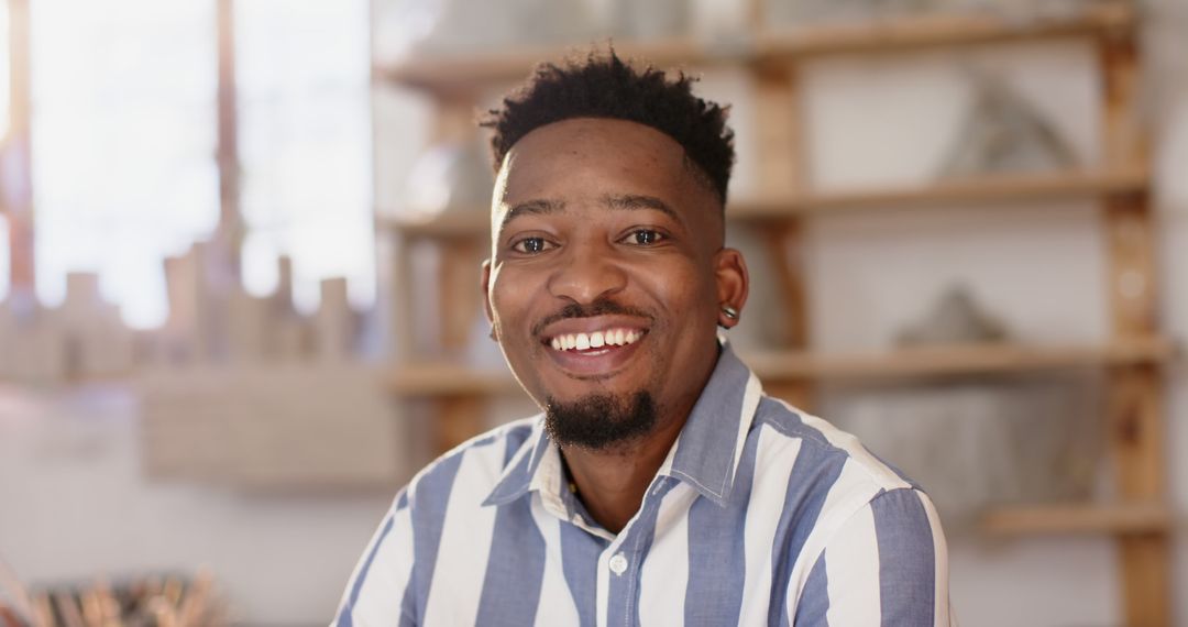 Smiling African American Man in Pottery Studio Creating Ceramics