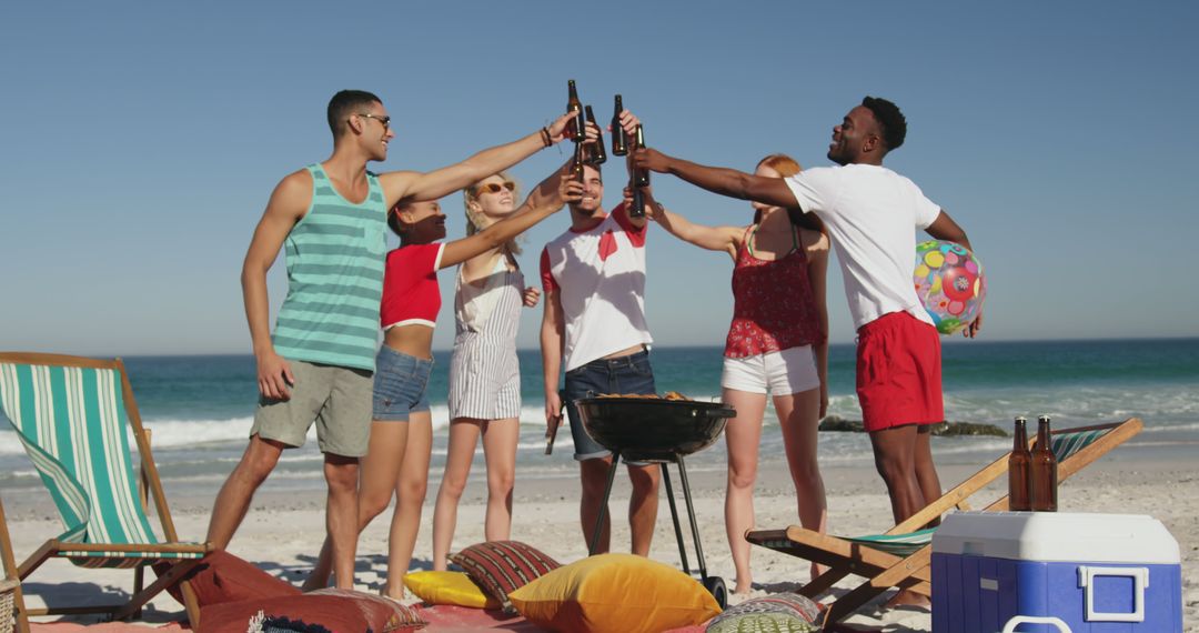 Diverse Group of Friends Toasting on Beach by Barbecue - Free Images, Stock Photos and Pictures on Pikwizard.com