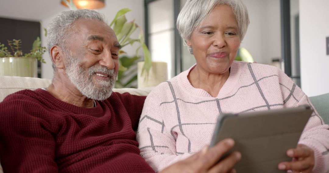 Senior Couple Enjoying Video Call Together at Home