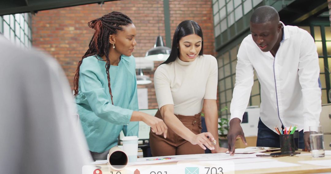 Diverse Team Analyzing Blueprint in Modern Office