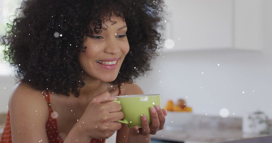 Joyful Woman Enjoying Coffee in Illuminated Kitchen - Free Images, Stock Photos and Pictures on Pikwizard.com