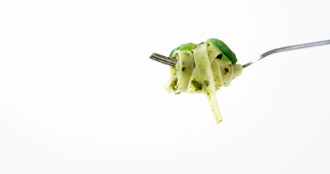 Fork with Tasty Pesto Pasta and Basil on White Background - Free Images, Stock Photos and Pictures on Pikwizard.com