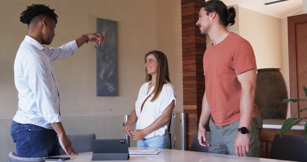 Team Discussing Ideas with Technology at Modern Office Table