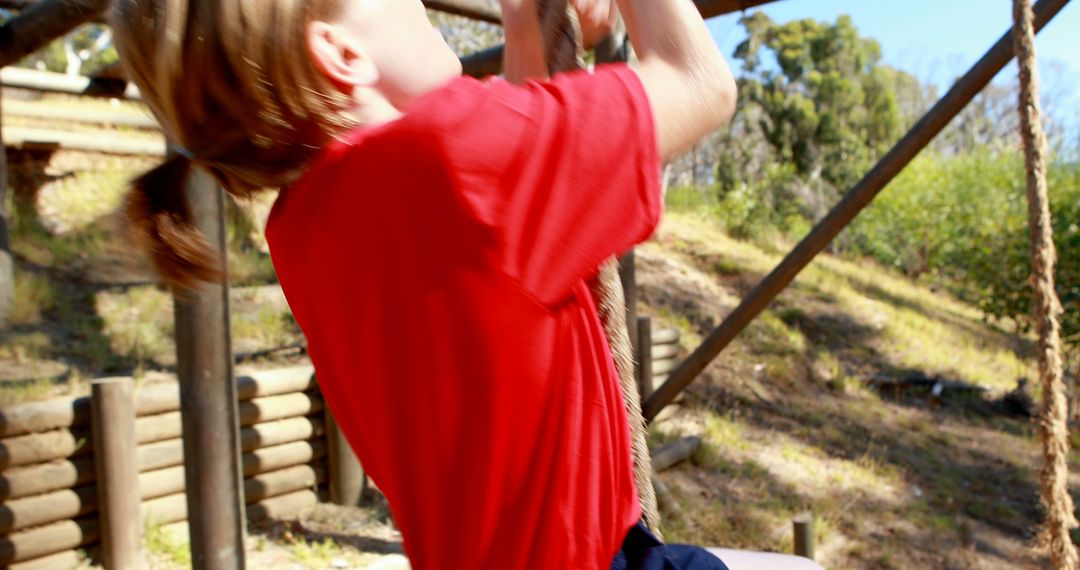 Child Climbing Rope on Outdoor Playground Adventure Course - Free Images, Stock Photos and Pictures on Pikwizard.com