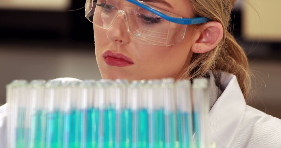 Female Scientist Analyzing Test Tubes in Laboratory - Free Images, Stock Photos and Pictures on Pikwizard.com