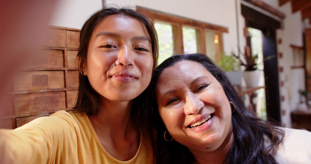 Diverse Mother and Daughter Taking Selfie at Home