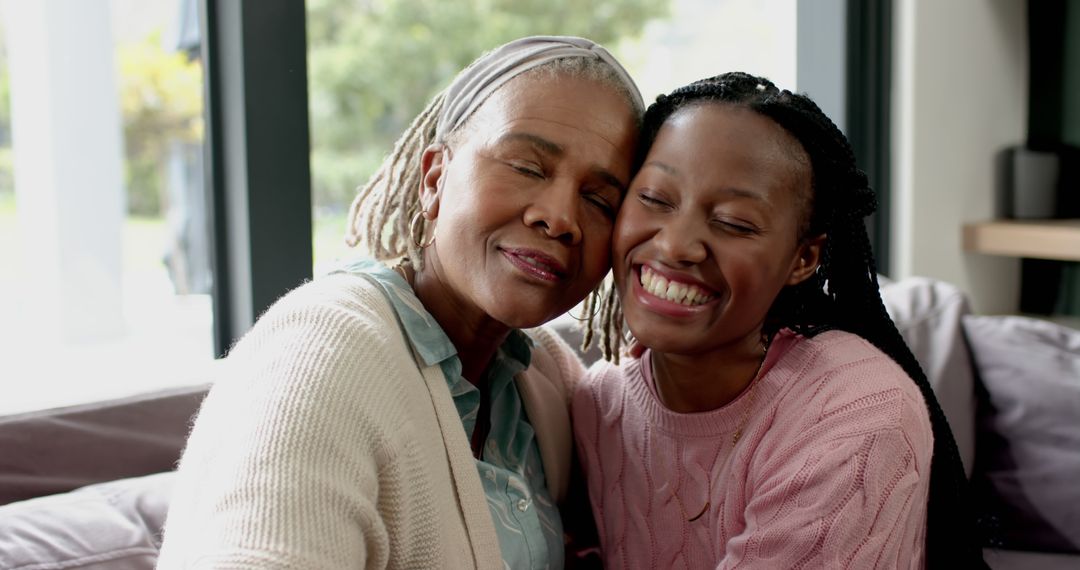 Loving African American Grandmother Embracing Teenage Granddaughter - Free Images, Stock Photos and Pictures on Pikwizard.com