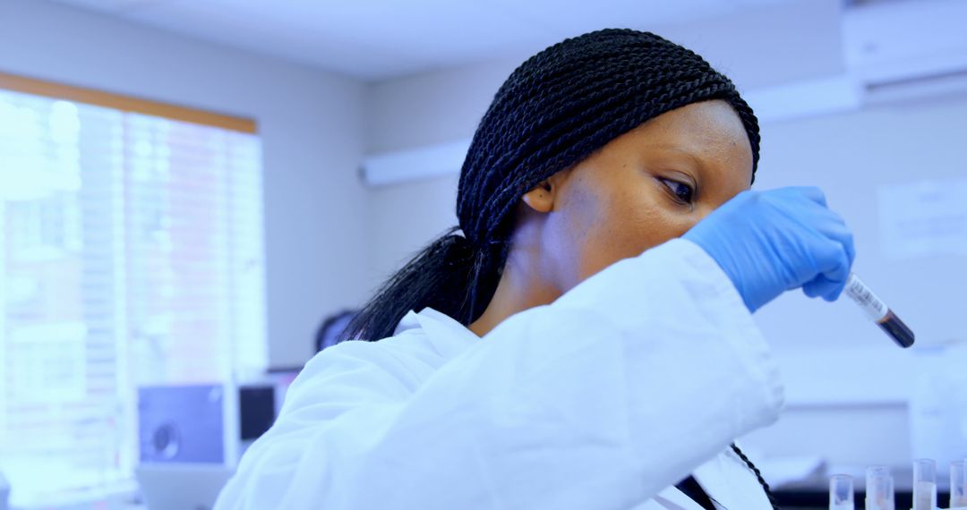 Female Scientist with Braided Hair Conducting Lab Test - Free Images, Stock Photos and Pictures on Pikwizard.com