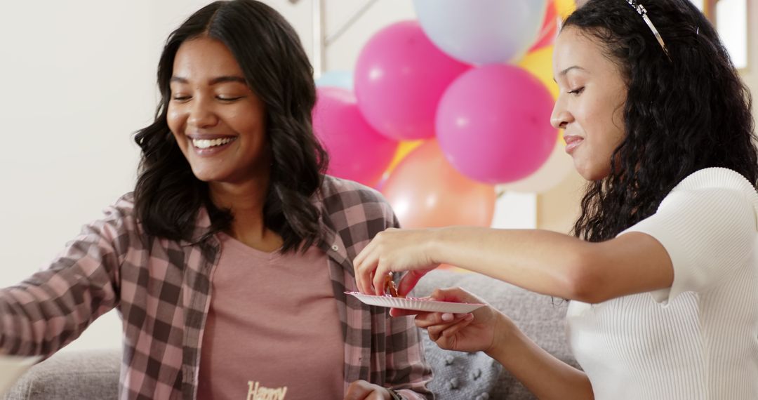 Two Friends Enjoying a Festive Gathering with Snacks and Decor