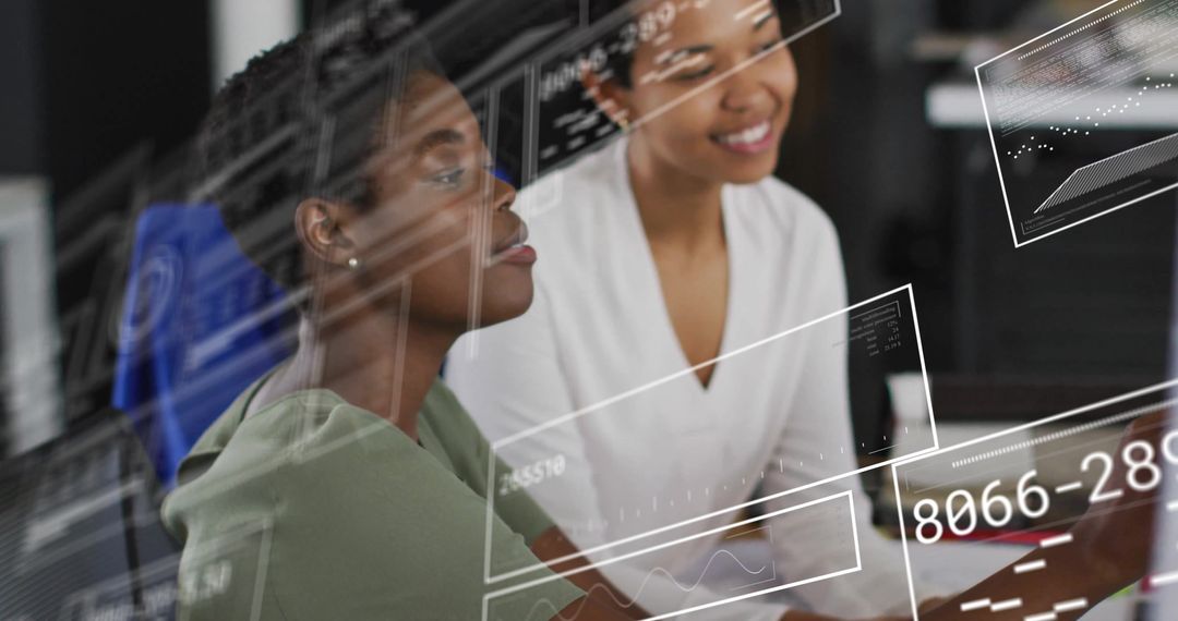 Diverse Businesswomen Analyzing Digital Data in Office