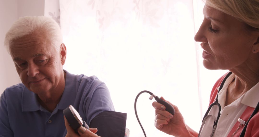 Senior Patient Getting Blood Pressure Checked by Nurse - Free Images, Stock Photos and Pictures on Pikwizard.com