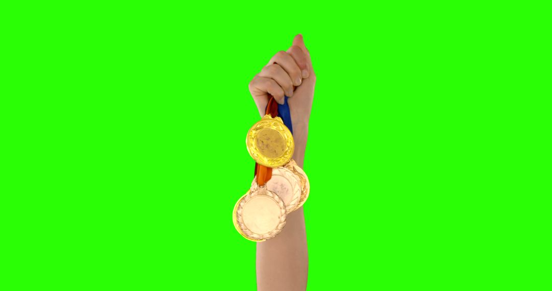 Hand Holding Medals Celebrating Achievements Green Screen Background - Free Images, Stock Photos and Pictures on Pikwizard.com