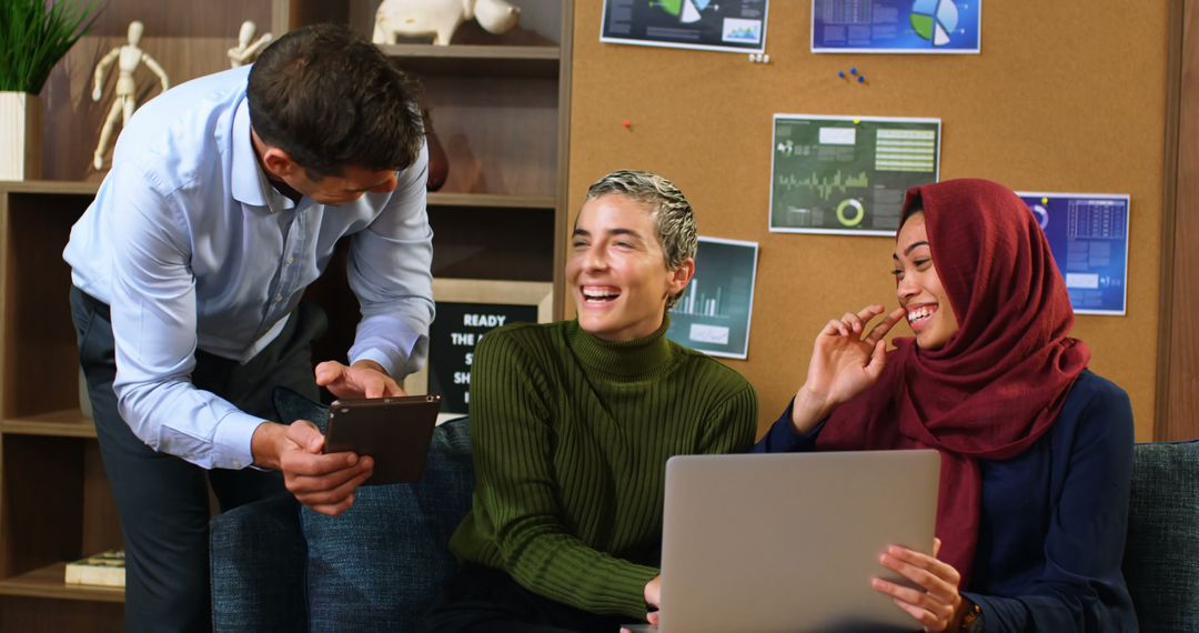 Diverse Team Engaging in Friendly Office Collaboration