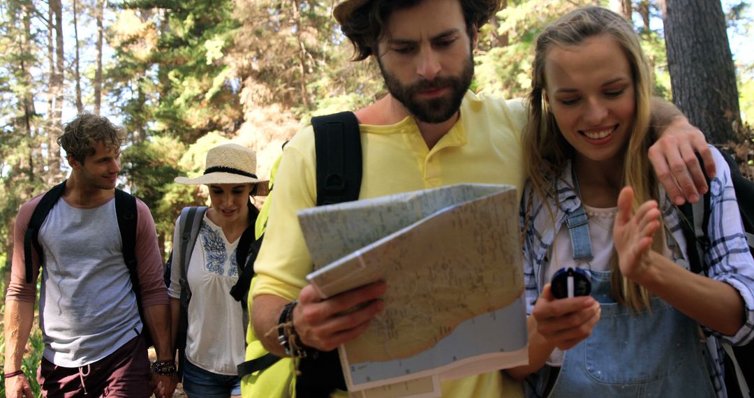 Group of Friends Hiking in Forest Reading Map and GPS - Free Images, Stock Photos and Pictures on Pikwizard.com