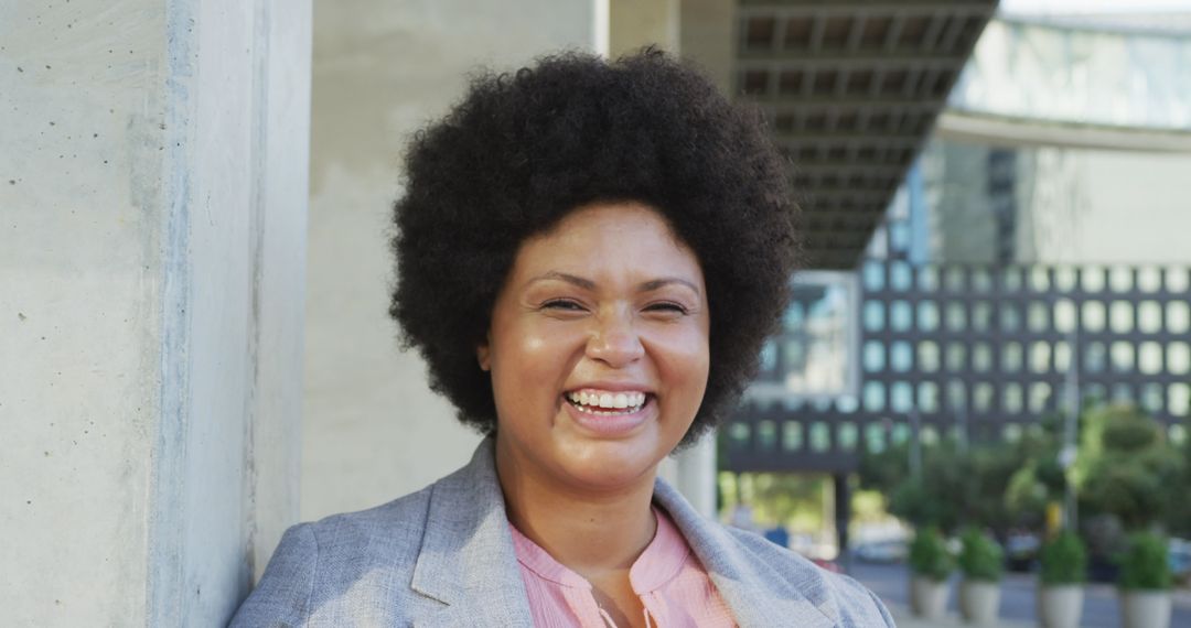 Smiling Biracial Woman in Urban Environment Embracing Inclusivity