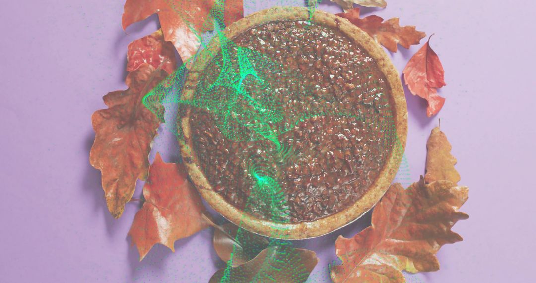 Displaying autumn pecan tart flatlay on pastel purple backdrop with dried leaves