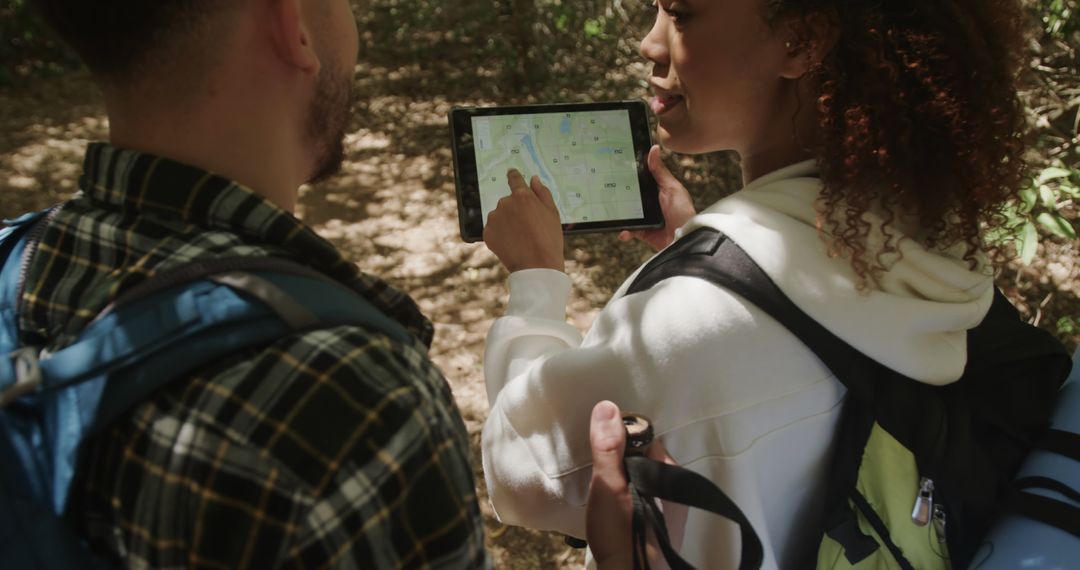 Two Friends Hiking and Navigating with Digital Tablet - Free Images, Stock Photos and Pictures on Pikwizard.com