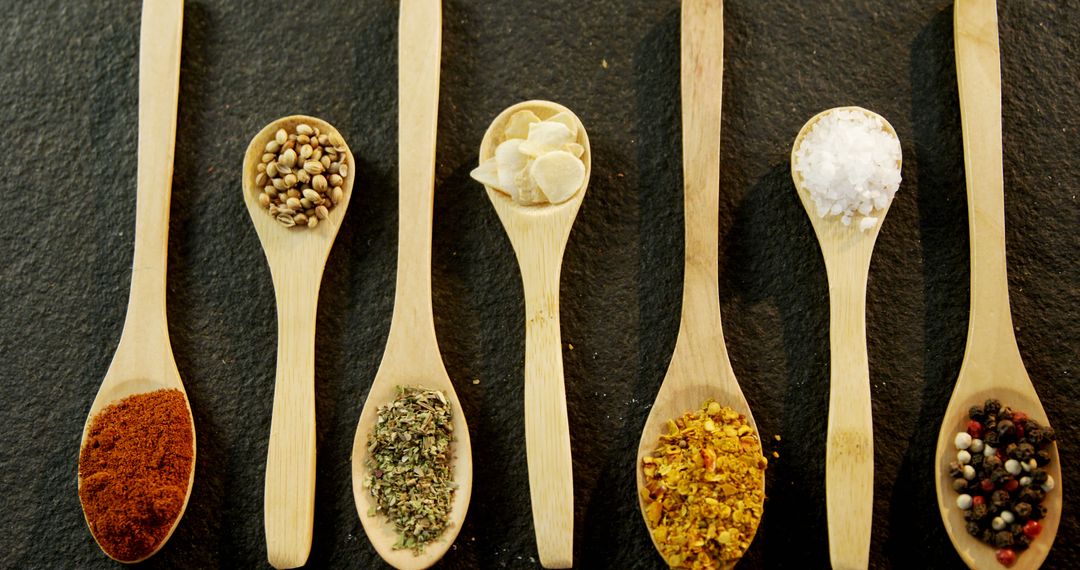 Wooden Spoons with Various Spices on Black Background - Free Images, Stock Photos and Pictures on Pikwizard.com