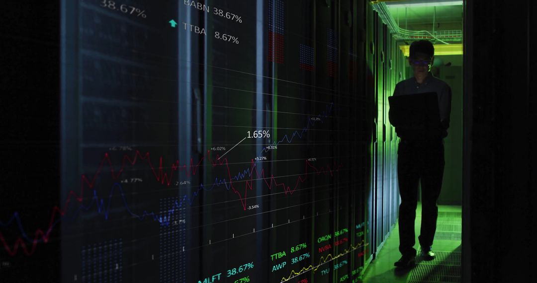 Asian IT Engineer Analyzing Data in Server Room with Projected Charts